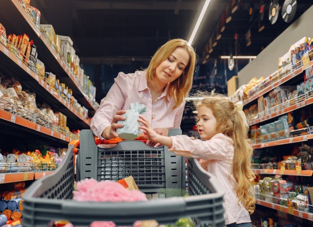 A mom and daughter doing groceries.
