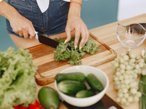 a woman chopping vegetables
