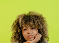 a woman eating a peach