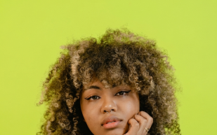 a woman eating a peach
