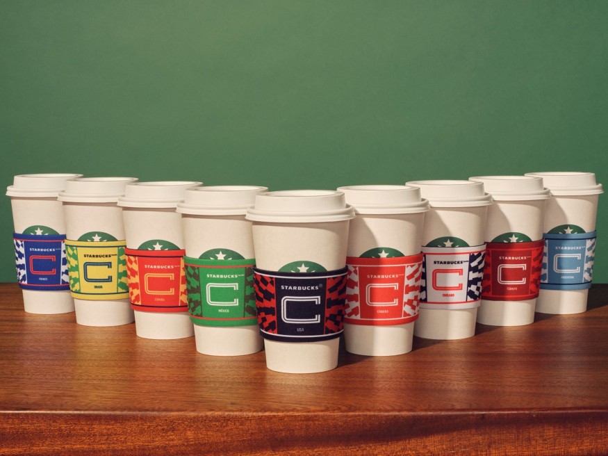 A lineup of multiple Starbucks cups
