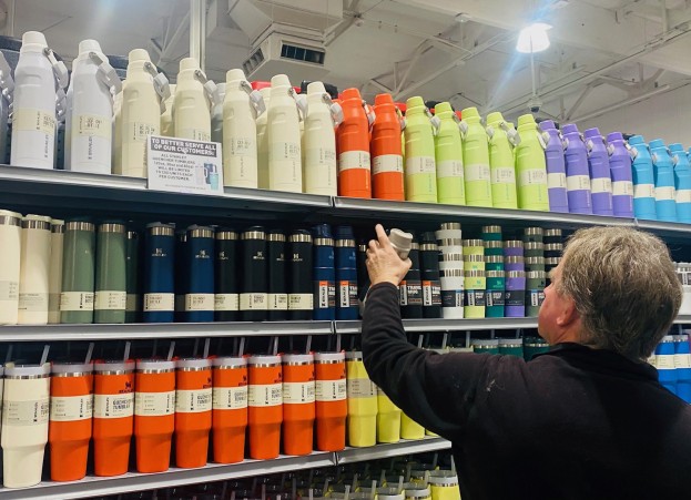 Man shops for Stanley cups.